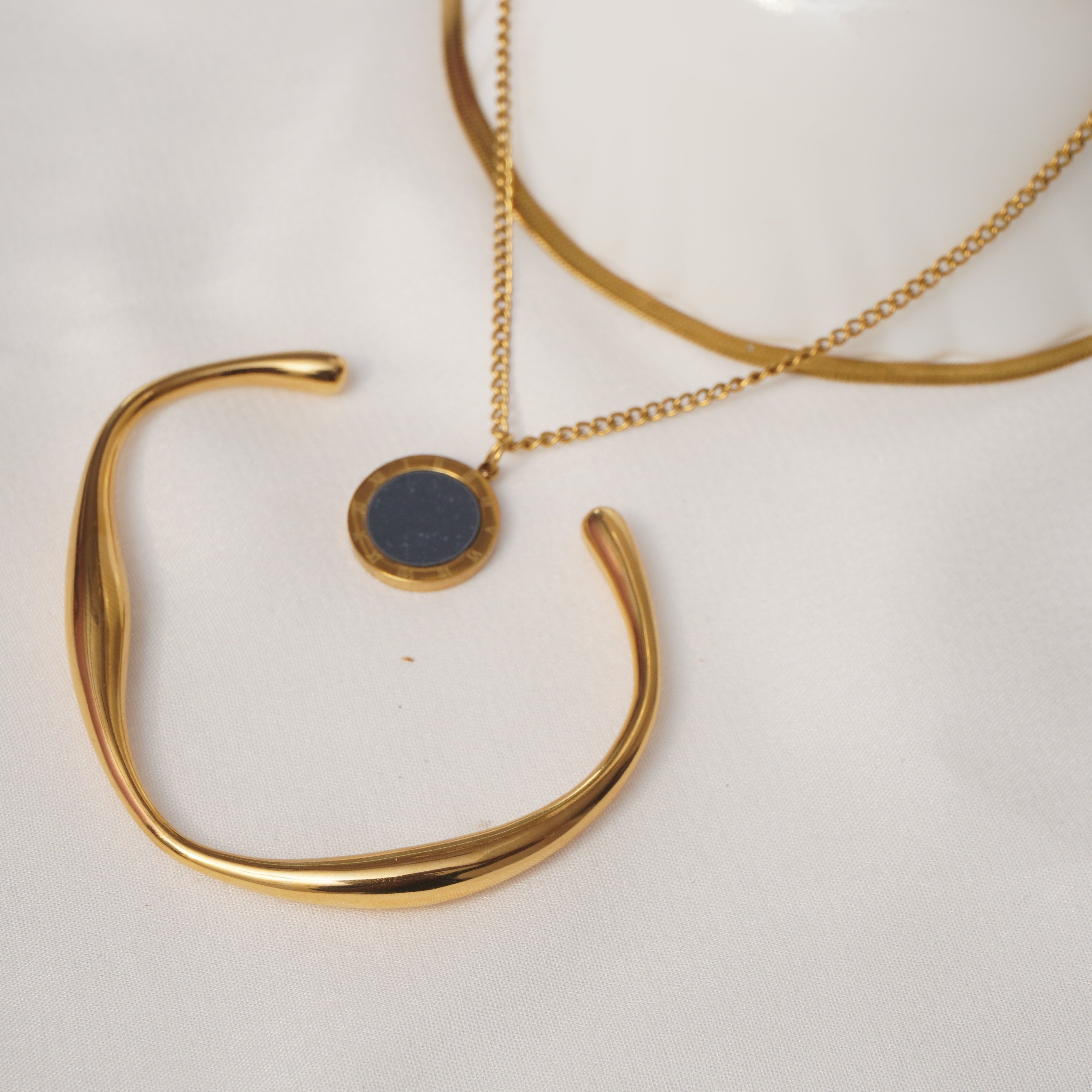 Auric Curve Minimal cuff and Solar Eclipse Pendant set