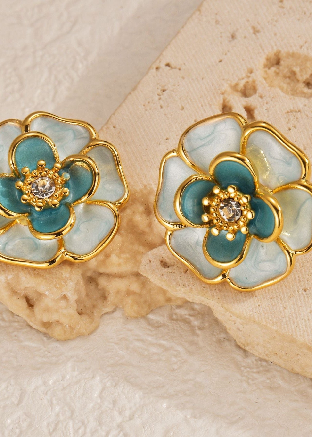 Floral earrings with gold and teal design 